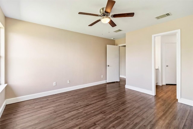 804 Lavaca Loop, Elgin, TX 78621 - unfurnished bedroom with dark wood-type flooring and ceiling fan