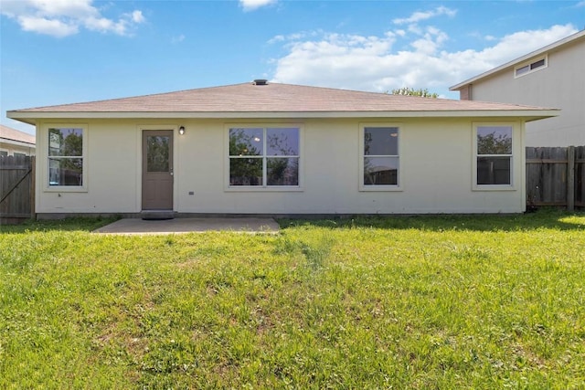 804 Lavaca Loop, Elgin, TX 78621 - back of property with a patio area and a shingled roof