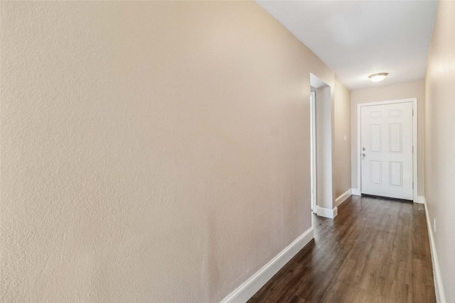 804 Lavaca Loop, Elgin, TX 78621 - hall with baseboards and dark wood-style flooring