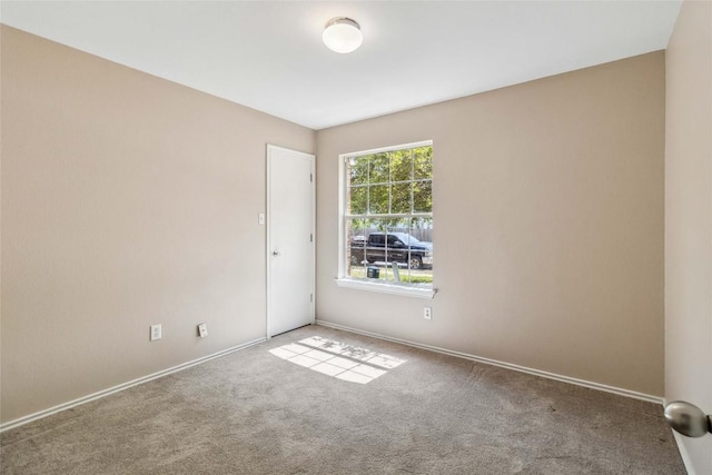 804 Lavaca Loop, Elgin, TX 78621 - spare room featuring carpet and baseboards