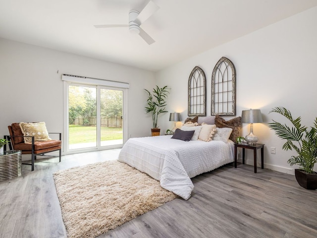8004 Osborne Dr, Austin, TX 78729 - bedroom featuring access to exterior, wood finished floors, and ceiling fan