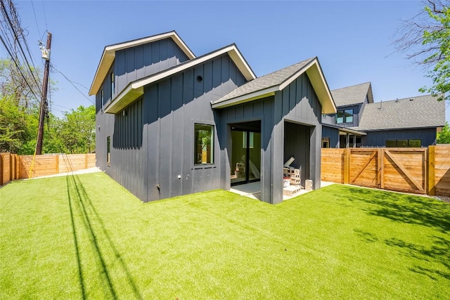 3306 Larry Ln Unit B, Austin, TX 78722 - back of house featuring board and batten siding, a fenced backyard, a patio, a shingled roof, and a gate