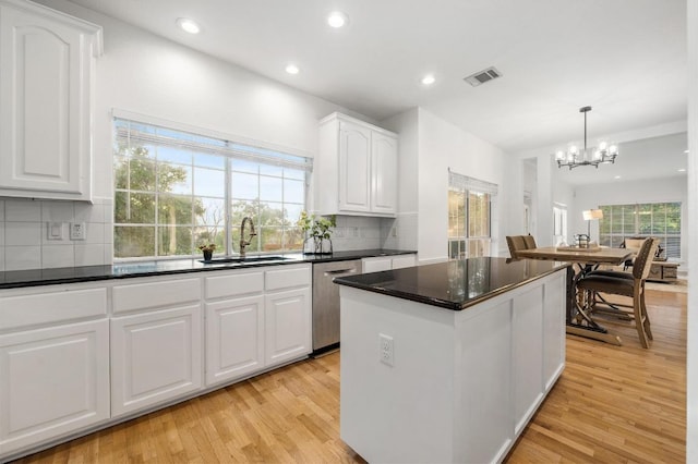 5204 Eagle Trace Trl, Austin, TX 78730 - kitchen featuring a sink, dishwasher, a kitchen island, dark countertops, and a chandelier