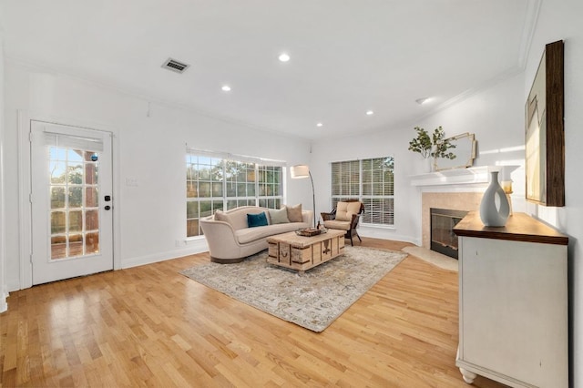 5204 Eagle Trace Trl, Austin, TX 78730 - living room featuring light wood-type flooring, a fireplace with flush hearth, recessed lighting, baseboards, and ornamental molding