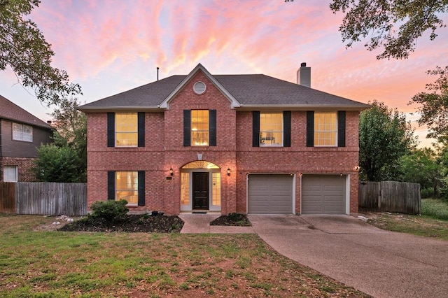 5204 Eagle Trace Trl, Austin, TX 78730 - view of front of property featuring a chimney, brick siding, driveway, and a garage