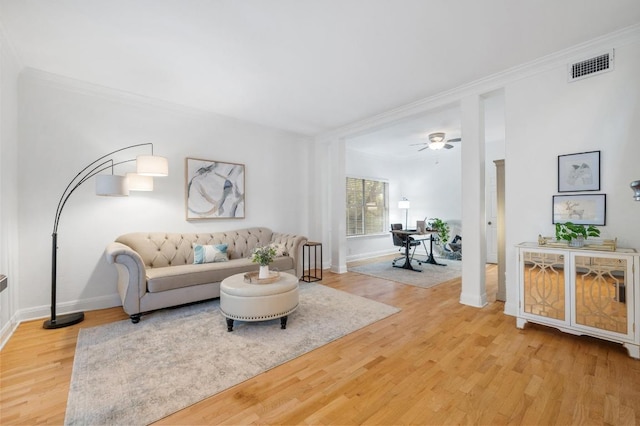 5204 Eagle Trace Trl, Austin, TX 78730 - living room featuring ornamental molding, light wood-style flooring, baseboards, and ceiling fan