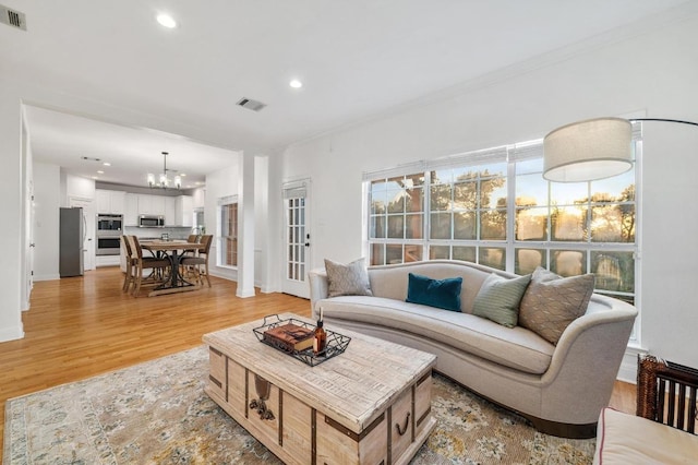 5204 Eagle Trace Trl, Austin, TX 78730 - living room with a chandelier, light wood finished floors, recessed lighting, and baseboards