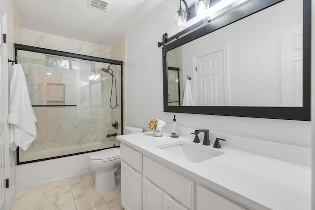 5204 Eagle Trace Trl, Austin, TX 78730 - full bath featuring toilet, marble finish floors, vanity, and shower / bath combination with glass door