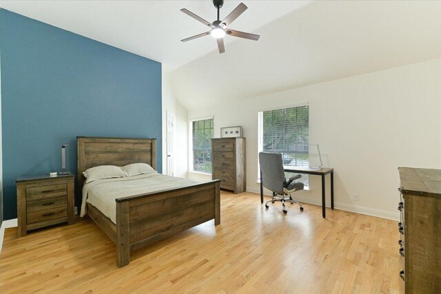 5204 Eagle Trace Trl, Austin, TX 78730 - bedroom with an office area, light wood-type flooring, vaulted ceiling, baseboards, and ceiling fan