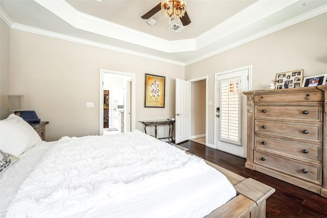 3028 Indigo Trl, Round Rock, TX 78665 - bedroom with a tray ceiling, dark wood-style flooring, ornamental molding, and ceiling fan