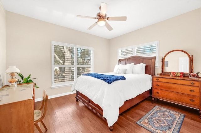 3028 Indigo Trl, Round Rock, TX 78665 - bedroom featuring multiple windows, dark wood-style flooring, and a ceiling fan