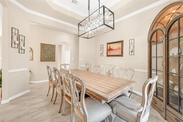 3028 Indigo Trl, Round Rock, TX 78665 - dining room featuring arched walkways, baseboards, ornamental molding, and a chandelier