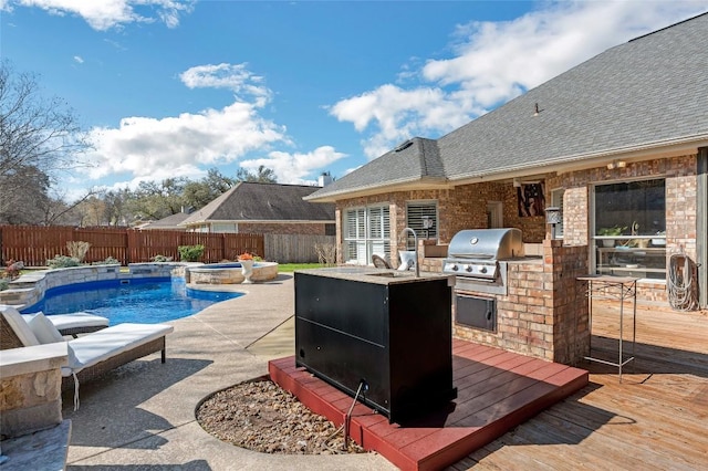 3028 Indigo Trl, Round Rock, TX 78665 - view of swimming pool featuring a wooden deck, a fenced backyard, a sink, and a jacuzzi