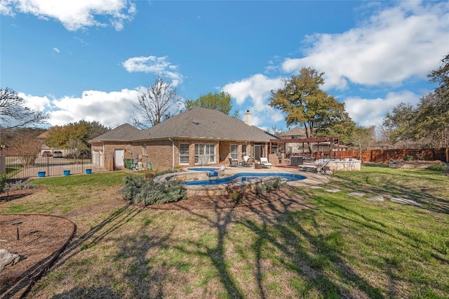 3028 Indigo Trl, Round Rock, TX 78665 - rear view of house with an in-ground hot tub, a chimney, a patio, and brick siding