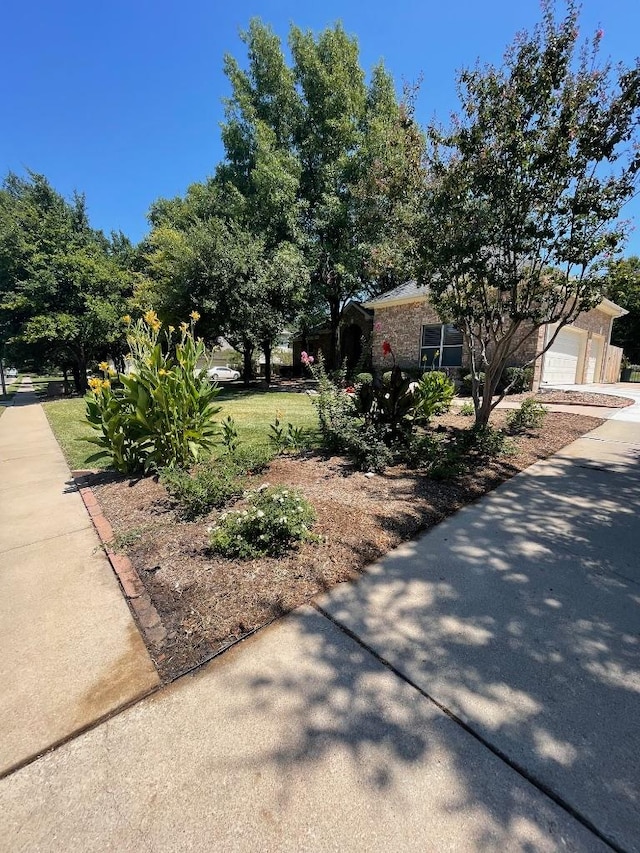 3028 Indigo Trl, Round Rock, TX 78665 - view of property exterior with driveway and a garage