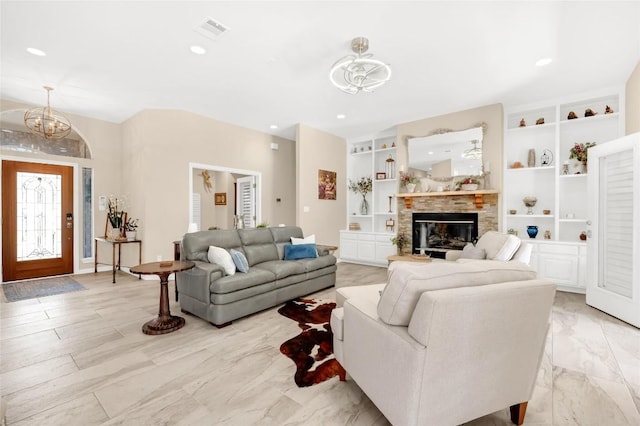 3028 Indigo Trl, Round Rock, TX 78665 - living area featuring a chandelier, a stone fireplace, built in features, and recessed lighting