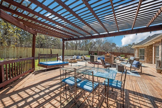 3028 Indigo Trl, Round Rock, TX 78665 - wooden deck with an outdoor living space with a fire pit, a fenced backyard, a pergola, and outdoor dining space