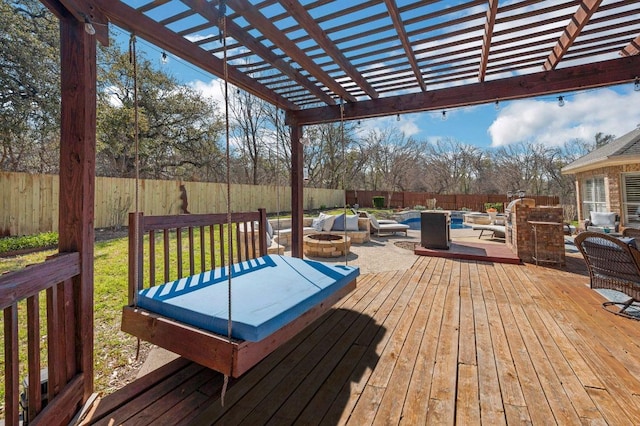 3028 Indigo Trl, Round Rock, TX 78665 - wooden deck with a fenced backyard, a pergola, and an outdoor living space with a fire pit