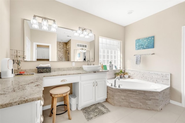3028 Indigo Trl, Round Rock, TX 78665 - full bath featuring a garden tub, vanity, a shower, and tile patterned flooring