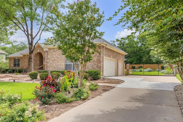 3028 Indigo Trl, Round Rock, TX 78665 - view of front facade featuring driveway, brick siding, and an attached garage