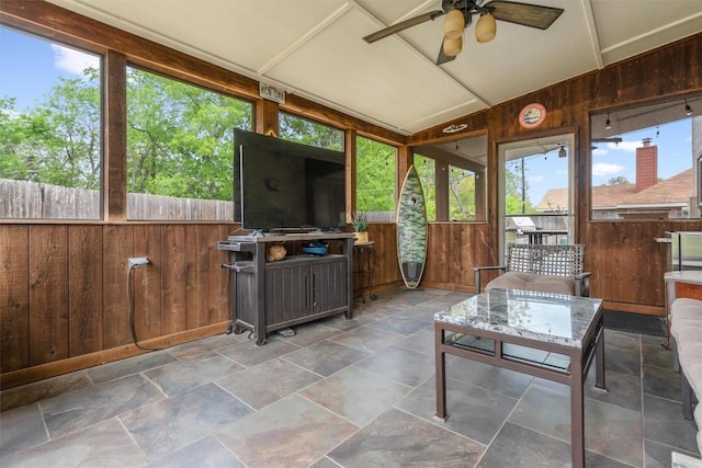 sunroom / solarium with a ceiling fan and plenty of natural light