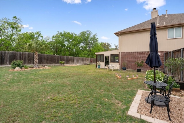 view of yard with a fenced backyard