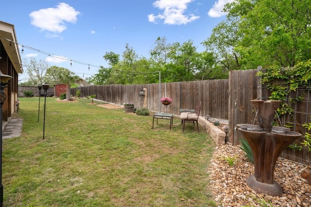 view of yard featuring a fenced backyard