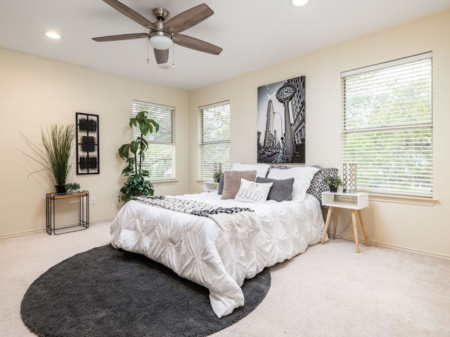 8001 Rimini Trl, Austin, TX 78729 - bedroom featuring carpet, multiple windows, recessed lighting, baseboards, and ceiling fan