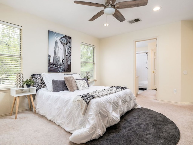 8001 Rimini Trl, Austin, TX 78729 - bedroom featuring light carpet, recessed lighting, connected bathroom, and a ceiling fan