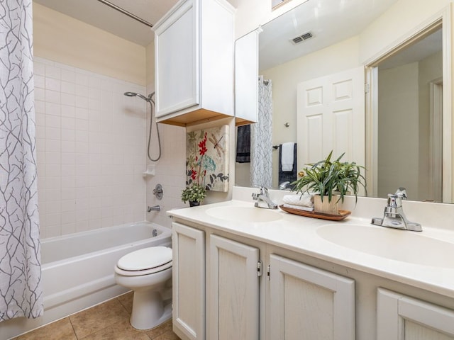 8001 Rimini Trl, Austin, TX 78729 - bathroom with double vanity, tile patterned floors, shower / bath combination with curtain, and toilet