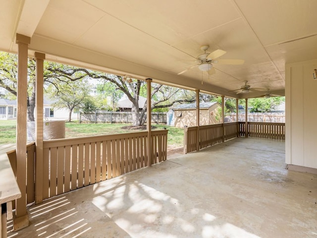 8001 Rimini Trl, Austin, TX 78729 - view of patio featuring a ceiling fan and a storage unit