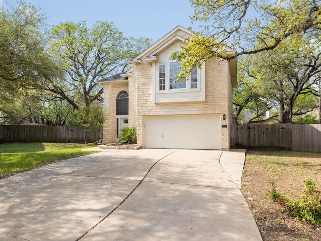 8001 Rimini Trl, Austin, TX 78729 - traditional-style home featuring concrete driveway, a garage, and stone siding