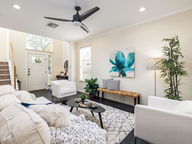 8001 Rimini Trl, Austin, TX 78729 - tiled living room with stairway, recessed lighting, ornamental molding, ceiling fan, and baseboards