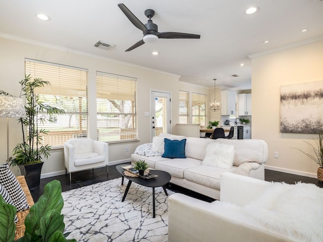8001 Rimini Trl, Austin, TX 78729 - living area featuring baseboards, ornamental molding, a chandelier, wood finished floors, and recessed lighting