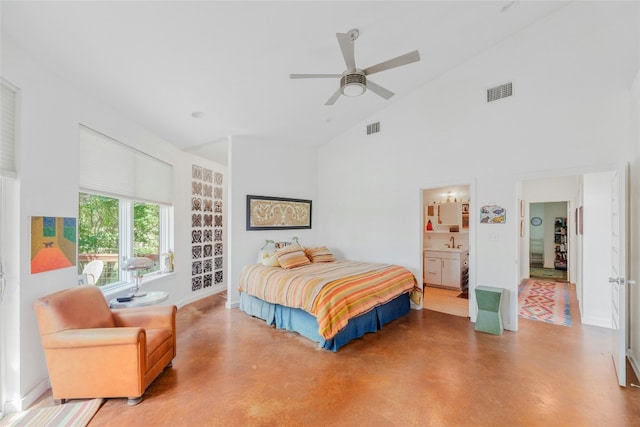 bedroom featuring high vaulted ceiling, visible vents, concrete floors, and a sink