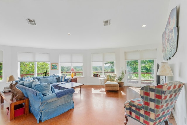living area featuring recessed lighting and visible vents