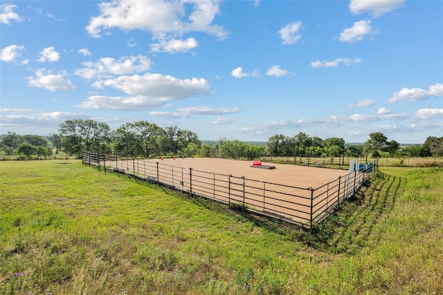view of yard with a rural view and an enclosed area