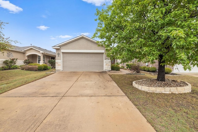 839 Salado Creek Ln, Georgetown, TX 78633 - view of front facade with stucco siding, an attached garage, driveway, and stone siding