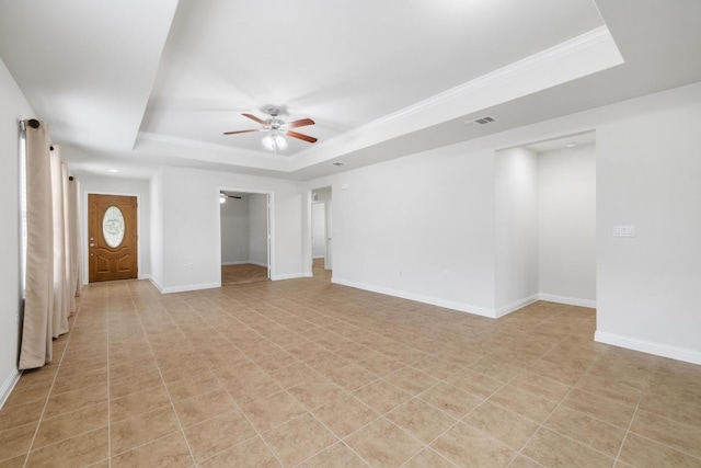 839 Salado Creek Ln, Georgetown, TX 78633 - unfurnished living room with visible vents, a ceiling fan, baseboards, and a tray ceiling