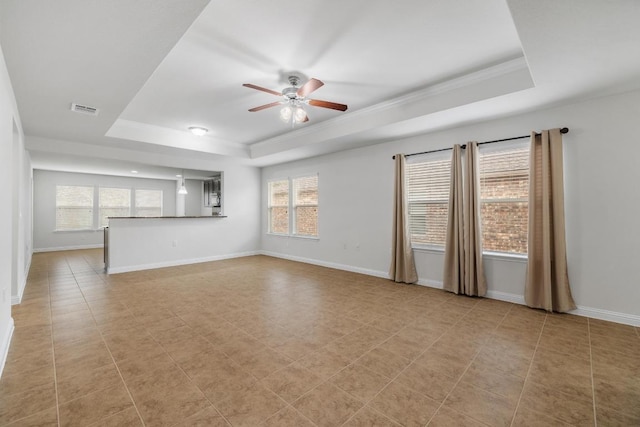 839 Salado Creek Ln, Georgetown, TX 78633 - unfurnished living room with crown molding, a raised ceiling, a ceiling fan, baseboards, and visible vents