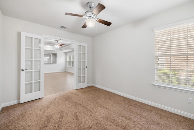 839 Salado Creek Ln, Georgetown, TX 78633 - carpeted spare room featuring french doors, a ceiling fan, a wealth of natural light, and visible vents