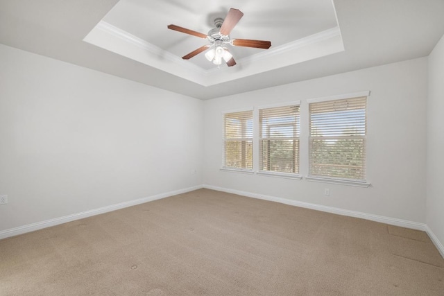 839 Salado Creek Ln, Georgetown, TX 78633 - empty room featuring a ceiling fan, light colored carpet, crown molding, a raised ceiling, and baseboards