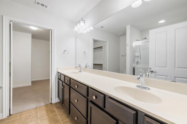 839 Salado Creek Ln, Georgetown, TX 78633 - bathroom with a sink, a stall shower, double vanity, and visible vents