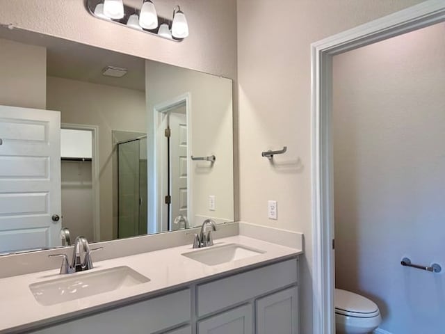 236 Hidalgo Ln, Elgin, TX 78621 - bathroom featuring a stall shower and double vanity