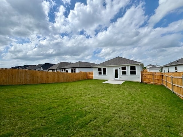 236 Hidalgo Ln, Elgin, TX 78621 - rear view of property with a fenced backyard and a patio