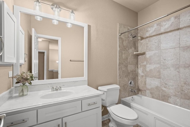 full bath with toilet, vanity, a textured wall, and  shower combination