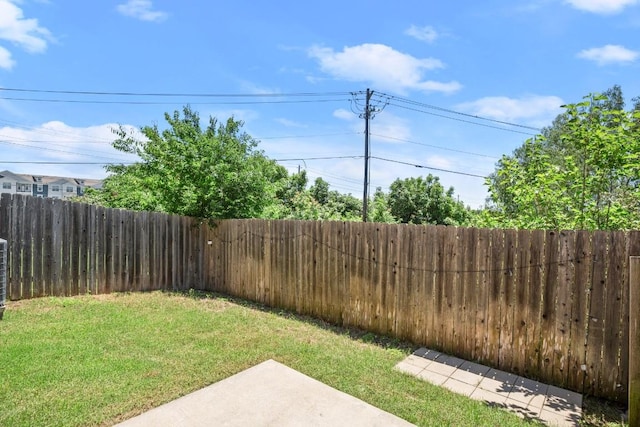 view of yard with a fenced backyard