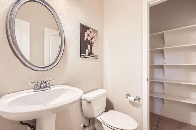 2920 Agave Loop, Round Rock, TX 78681 - half bath featuring tile patterned flooring and a textured wall