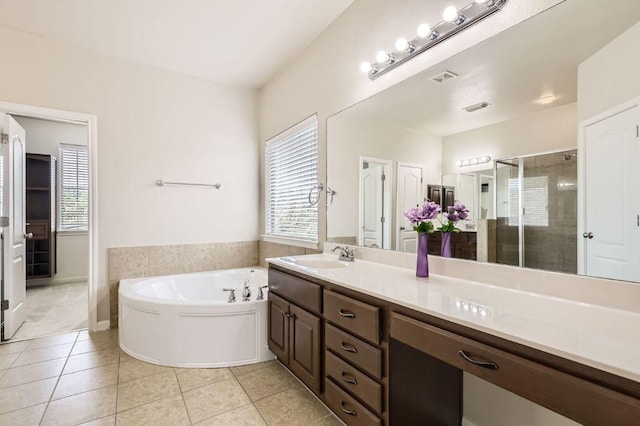 2920 Agave Loop, Round Rock, TX 78681 - full bathroom featuring a stall shower, a garden tub, vanity, and tile patterned flooring