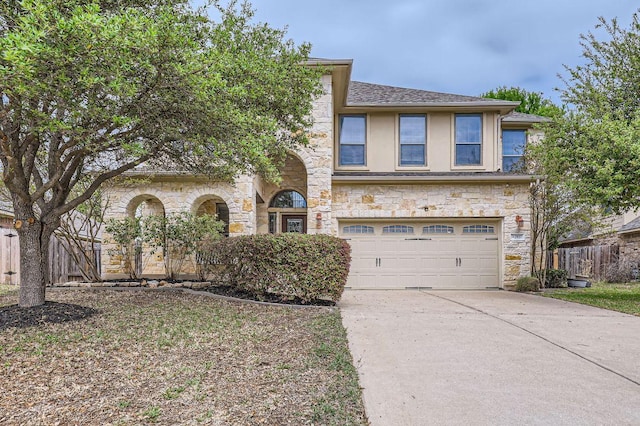 2920 Agave Loop, Round Rock, TX 78681 - view of front facade featuring stone siding, an attached garage, driveway, and stucco siding
